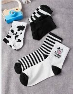 ⁦طقم جوارب قطنية محبوكة بنمط جديد للنساء، جوارب طويلة بنمط بقرة بلون ابيض واسود (عبوة من 4 قطع)⁩ - الصورة ⁦4⁩